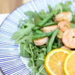 orange garlic shrimp with green beans and aruguala