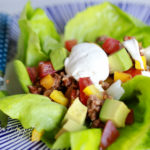 Easy Paleo Taco Salad on blue plate with polka dotted blue fork