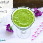 Green Smoothie with purple flowers and pink paper straws