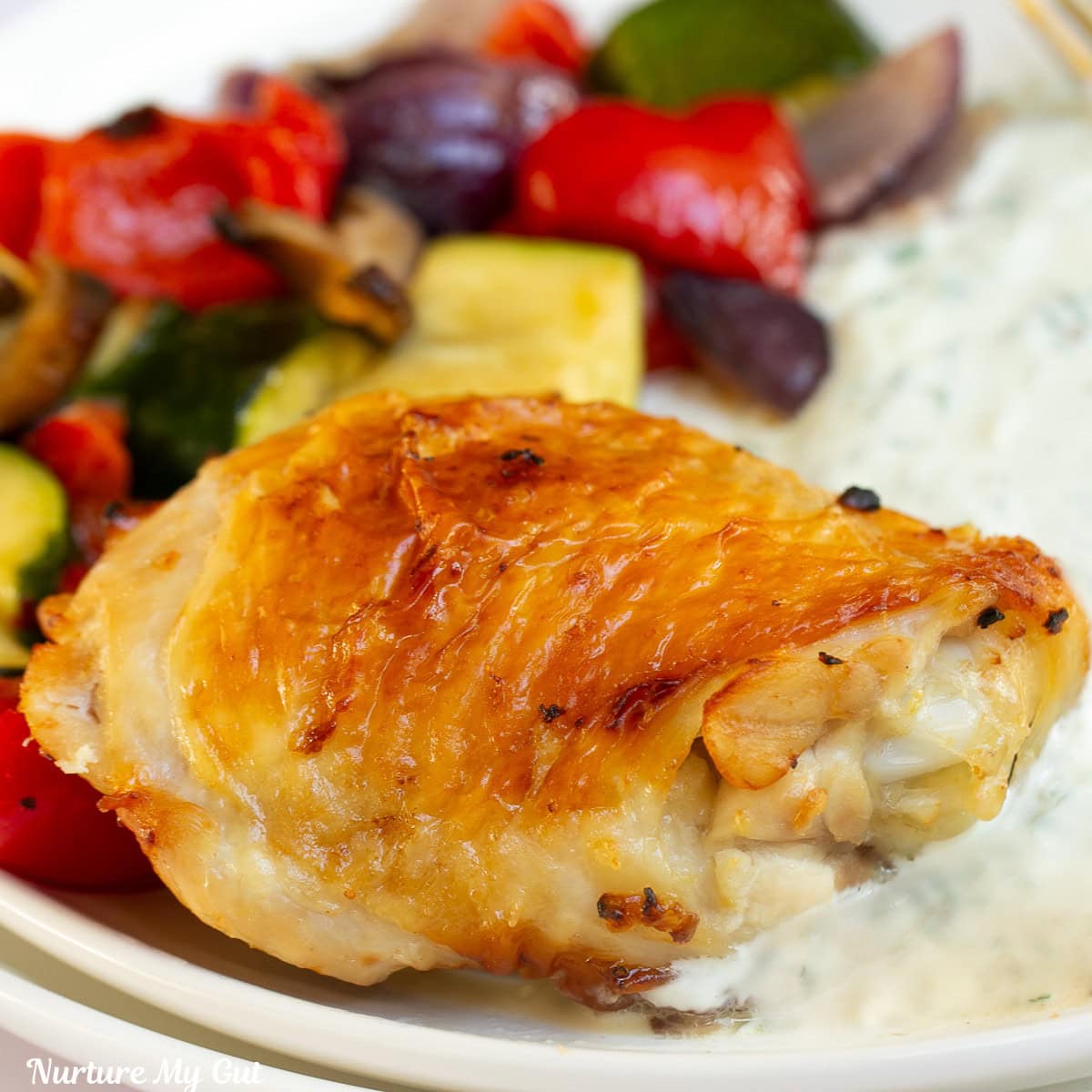 chicken thighs and vegetables on plate
